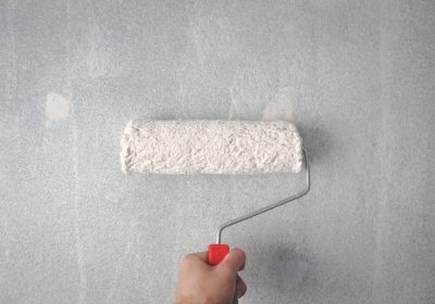 person-holding-paint-roller-on-wall-1669754 (1)